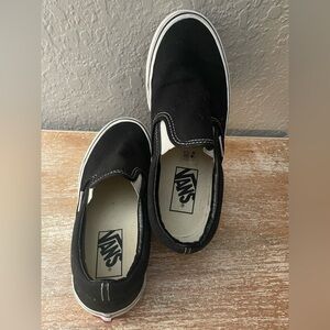Black Vans slip ons